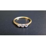 An 18ct Yellow Gold and Diamond Three Stone Ring, size N.5, 2g