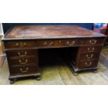 A Heaton Tabb & Co. Mahogany Partner's Desk Partner's Desk with gadrooned top and ball and claw