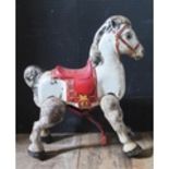 A Vintage Mabo Mechanical Ride Along Horse (circa 1960) approx. 82cm at its tallest.