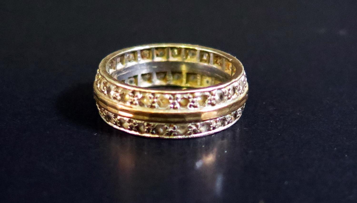 A 9ct White and Yellow Gold Diamond Twin Row Eternity Ring, size O.5, 5.5g