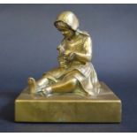 A Bronze Sculpture of a seated girl holding a squirrel, 11.5cm