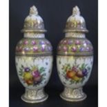 A Pair of Dresden Porcelain Vases with hand painted floral decoration, 35cm
