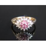 A 9ct Gold, Ruby and Diamond Cluster Ring, size M.5, 2.7g