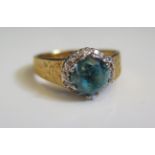 An 18ct Gold, Zircon and Diamond Ring, size Q.5, 6.1g, zircon c. 8mm