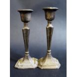 A Pair of Birmingham Loaded Silver Candlesticks, 14.5cm. A/F