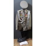 A G.D.R. Army Uniform, complete with tunic, shirt, tie, trousers, cap, gloves, belt and boots