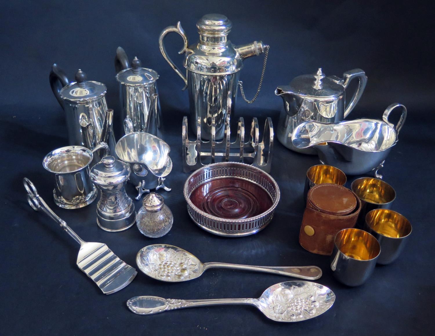 A Selection of Silver Plate including a pair of coffee pots, pepper mill, leather cased set of