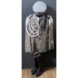 A G.D.R. Army Uniform, complete with tunic, shirt, tie, trousers, cap, belt and boots