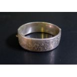 A Silver Hinged Bangle with acanthus chased decoration, 28g & A Turquoise Inlaid Cross