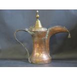 An Early and Large Middle Eastern Islamic Copper and Brass Coffee or Ritual Water Pot with pricked