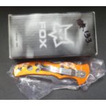 A Fox Twister Knife with orange alum handle WIT-LK653, original receipt, boxed new old stock