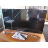 A Samsung UE40KU6470U TV with remote