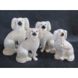 Three 19th century Staffordshire Poodles and spaniel, tallest 24cm