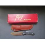 A Katz Knives Pro/45 Hunting Knife in leather sheath