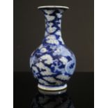 A 19th Century Chinese Blue and White Vase decorated with a dragon, four character Qianlong mark,