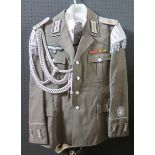 A G.D.R. Army Uniform, complete with tunic, shirt, tie, trousers, cap, belt and boots