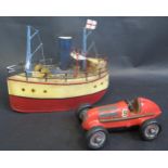 A Schuco No. 1050 Clockwork Mercedes Race Car and Modern Tin Model Boat