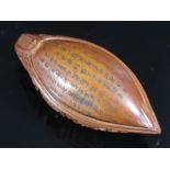 A Japanese Carved Ojime Boat with extensive script to the underside, 44mm