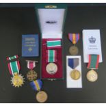 A Cased Women's Voluntary Service Medal, Women's Land Army medal, Liberation of Kuwait medal,