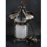 A Wrought Iron Pendant Light with frosted glass shade, c. 56cm to top of hanging loop and with