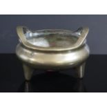 An Antique Chinese Bronze Censer with Xuande marks and dragons to the base, 17.5cm diam., 1197g