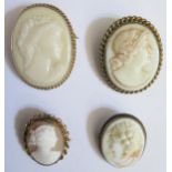 A Shell Cameo Brooch and three other, largest in silver mount c. 5cm