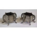 A Pair of Chinese Silver Salts raised on lizard legs and with chased foliate decoration, 59mm diam.,