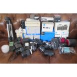 A Large Collection of Minolta Cameras, Lenses, Equipment and others including AF 17-35, AF 28-135,