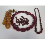 A Selection of Faux Amber (yellow 152g, large cherry 196g, small cherry 39.8g and loose beads 51g)