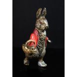 An Antique Cold Painted Beatrix Potter Rabbit with a cloak, c. 3cm