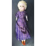 An Early Nineteenth Century Pumpkin Head Wax Doll with original silk dress, 36cm