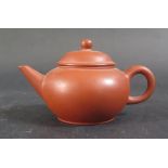 Three Chinese Yixing Teapots, largest 19.5cm long