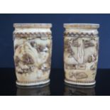 A Pair of 18th Century Chinese Carved Ivory Vases, one decorated with a mountainous village scene