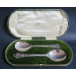 A George V Cased Pair of Silver Serving Spoons with pierced foliate handles, Sheffield 1910, Lee &