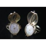 A Pair of Arctos Gold Plated Watch Rings, one running