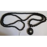 A Victorian Whitby Jet and Floral Inlaid Pendant on c. 130cm bead necklace