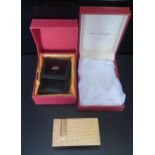 A Cased SJ Dupont Gold Plated Travel Alarm and leather sleeve