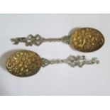 A Pair of Victorian Silver and Gilt Spoons with foliate scroll embossed and chased bowls and man