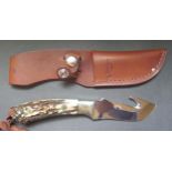 A Junglee Tak Fakuta Skinner Knife with stag antler handle by Sek, Japan and with leather sheath,