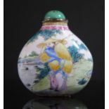A Chinese Enamel Snuff Bottle decorated with figures in a landscape with a turquoise stopper