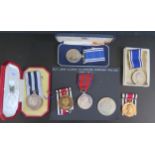 A Small Selection of Medals including cased George VI Distinguished Service Medal awarded to J.M.