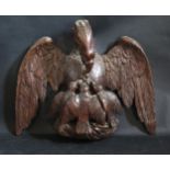 A Black Forest Carved Eagle Wall Plaque Feeding Chicks on a Nest, 42x34cm. A/F