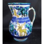 A Slovakian Faience Jug decorated with deer and birds, 28cm high. Collection of Mark M. Luboshinksky
