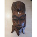 An African Carved Hardwood and Bone Inlaid Mask, 37cm
