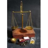 An Oak Cased Set of Collapsible Balance Scales with weights