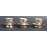 A Set of Three Chinese Silver Cups and saucers, 5.5cm diam., 111g