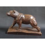 A Hungarian Carved Softwood Bear, base 32.5cm. A/F