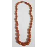 A Faux Amber Graduated Bead Necklace, 54cm, 35,1g, largest bead 22x16mm