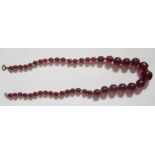 A Faux Amber Graduated Bead Necklace, 57cm, 25.4g, largest bead 16mm
