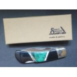 A Santa Fe Stoneworks Lockback Knife with malachite inlay, boxed new old stock